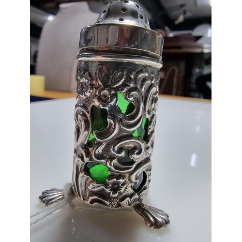 369 - A good quality hallmarked silver salt with an unusual green emerald glass liner with an ornate 
Peir... 