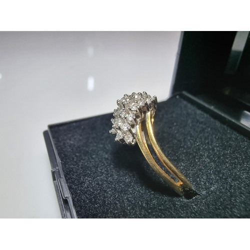 399 - A pretty hallmarked 18ct yellow gold diamond cluster ring, inset with approx 0.350 CT of diamonds wh... 