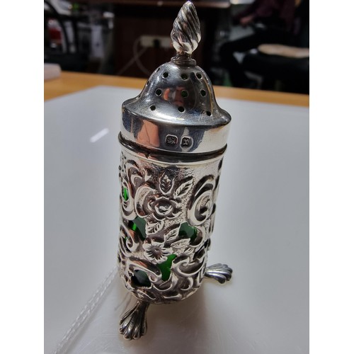 369 - A good quality hallmarked silver salt with an unusual green emerald glass liner with an ornate 
Peir... 