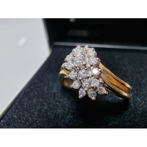 399 - A pretty hallmarked 18ct yellow gold diamond cluster ring, inset with approx 0.350 CT of diamonds wh... 