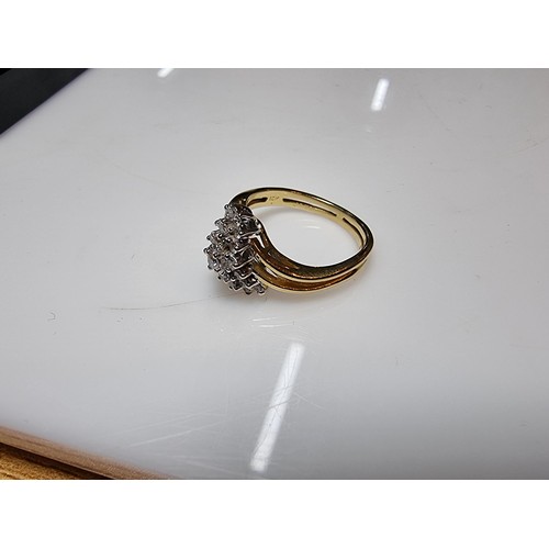 399 - A pretty hallmarked 18ct yellow gold diamond cluster ring, inset with approx 0.350 CT of diamonds wh... 