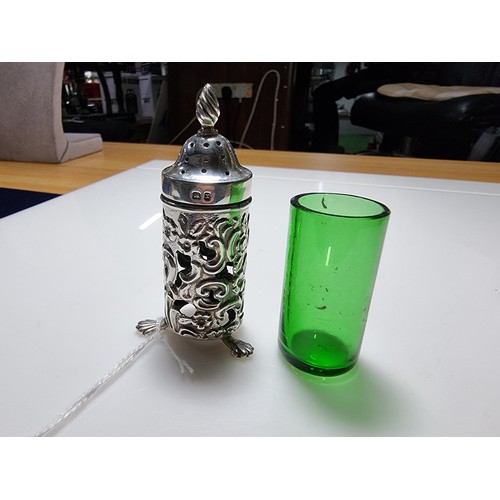 369 - A good quality hallmarked silver salt with an unusual green emerald glass liner with an ornate 
Peir... 