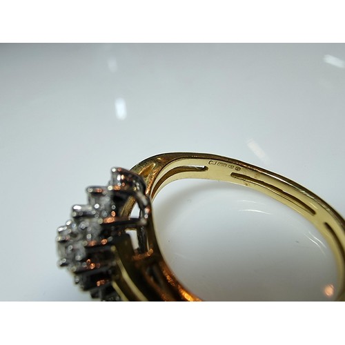 399 - A pretty hallmarked 18ct yellow gold diamond cluster ring, inset with approx 0.350 CT of diamonds wh... 