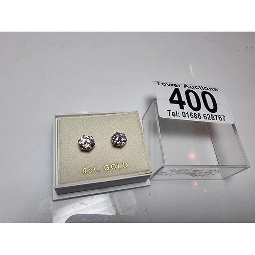 400 - A pair of 9ct yellow gold stud earrings inset with large CZ stones, in excellent clean condition and... 