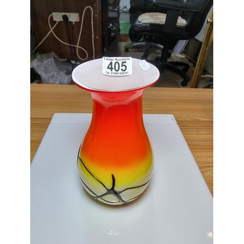 405 - A stunning art glass vase in sunset colours with an overlaid black web design to the base by an unkn... 