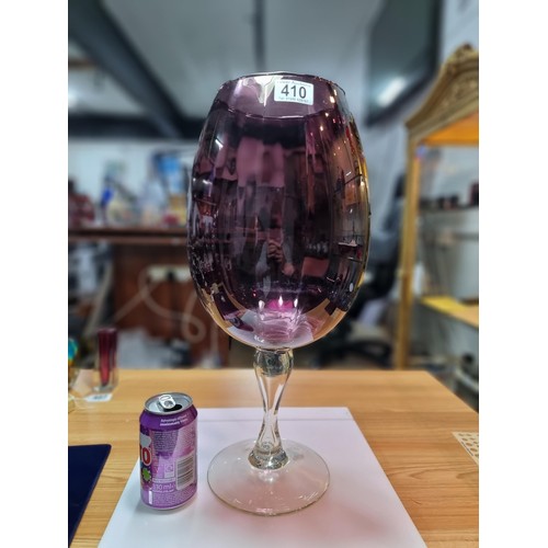 410 - A very large impressive retro wine glass formed vase in amethyst glass with a ribbed design in excel... 