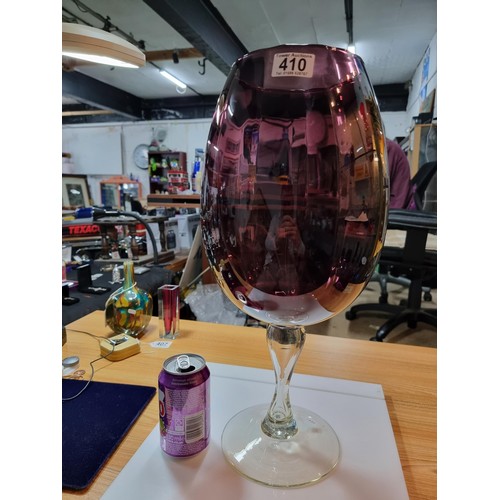 410 - A very large impressive retro wine glass formed vase in amethyst glass with a ribbed design in excel... 