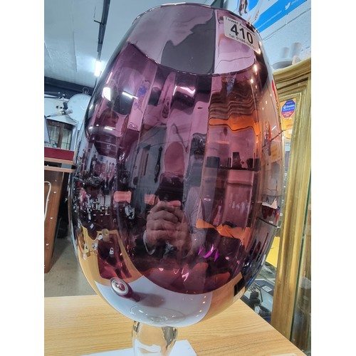 410 - A very large impressive retro wine glass formed vase in amethyst glass with a ribbed design in excel... 