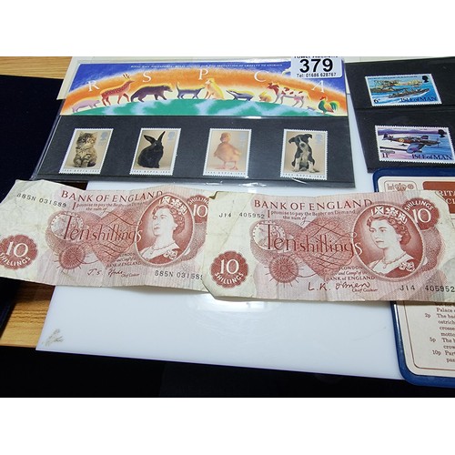 379 - A quantity of first day covers along with 2x English ten shilling notes, Britain's first decimal coi... 