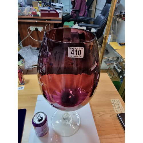 410 - A very large impressive retro wine glass formed vase in amethyst glass with a ribbed design in excel... 