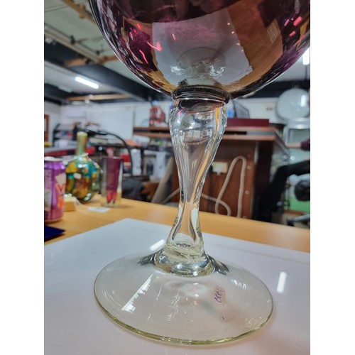 410 - A very large impressive retro wine glass formed vase in amethyst glass with a ribbed design in excel... 