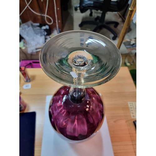 410 - A very large impressive retro wine glass formed vase in amethyst glass with a ribbed design in excel... 