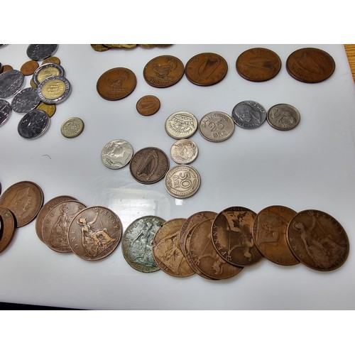 380 - A large quantity of various British and world coins to include a quantity of crowns, Irish coins, ol... 