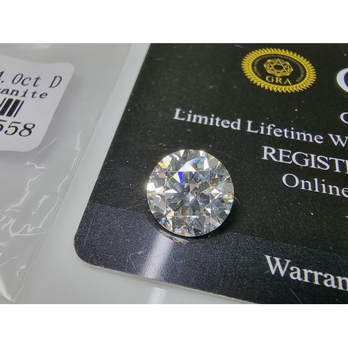 381 - A large 4ct moissanite diamond by GRA (gemological research agency) with full COA and moissanite rep... 