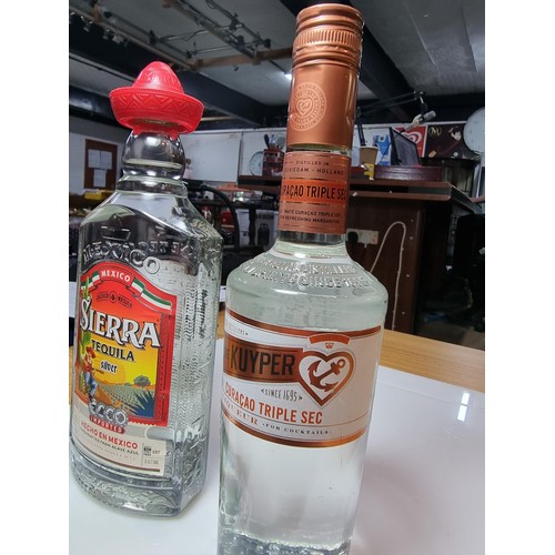 423 - 2 new and sealed bottles of liquor to include sierra tequila silver, bottle 50cl and a De Kuyper Cur... 