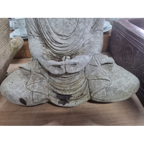 283 - Well formed concrete garden Buddha ornament  in good order, height 48cm length 36cm depth 25cm