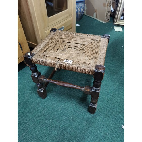 506A - Vintage dark oak rush topped stool in good order height 37cm, length 40cm, depth 36cm