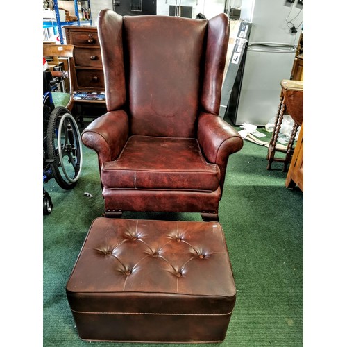 Good quality vintage leather fireside chair with pin studs to the edges