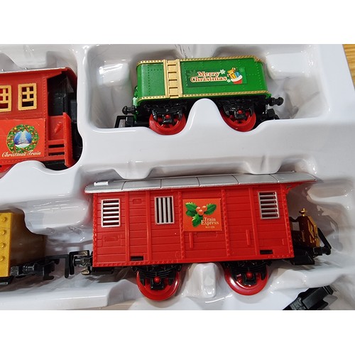 6 - A boxed as new Christmas workshop deluxe trainset to go round a Christmas tree, 330cm length of trac... 