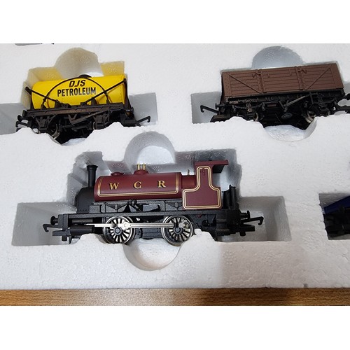 10 - A boxed Hornby R1157 Westcoast highlander trainset in very clean complete condition. Including its t... 