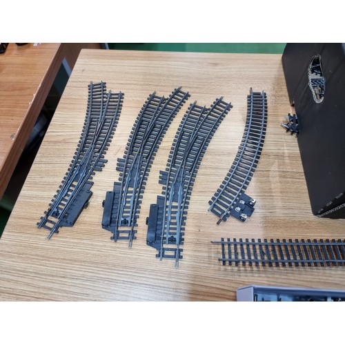 15 - A box containing a large quantity of OO gauge curved and straight track pieces, some with points alo... 