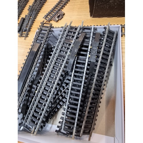 15 - A box containing a large quantity of OO gauge curved and straight track pieces, some with points alo... 