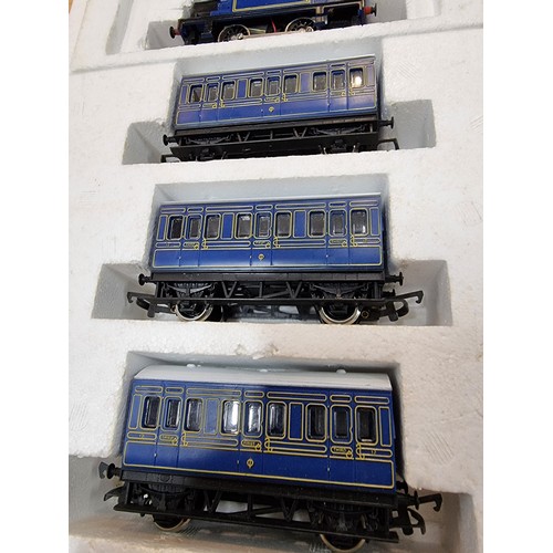 16 - A Hornby 7178 blue Caledonian locomotive and 3 matching coaches in as new condition. Never had any u... 