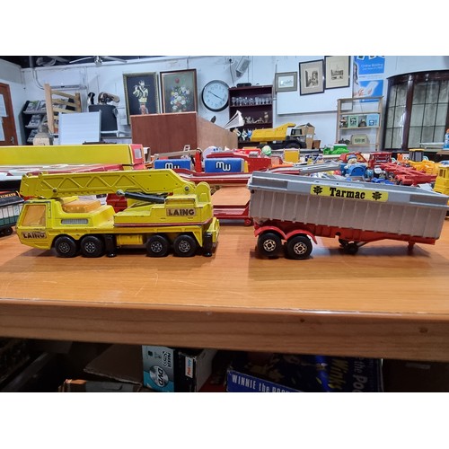 25 - A large collection of various vintage diecast vehicles to include some good long truck lorries inclu... 