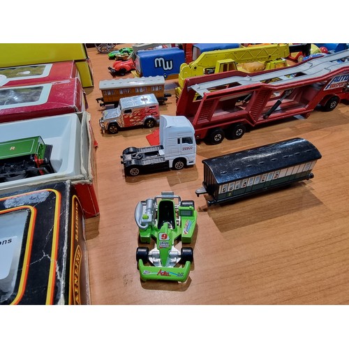 25 - A large collection of various vintage diecast vehicles to include some good long truck lorries inclu... 