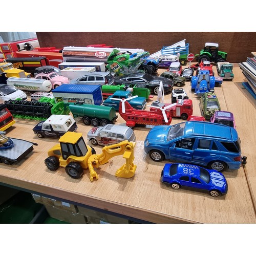 26 - A large quantity of various diecast cars and lorries including a quantity of truck trailers with adv... 