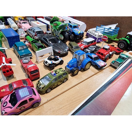 26 - A large quantity of various diecast cars and lorries including a quantity of truck trailers with adv... 