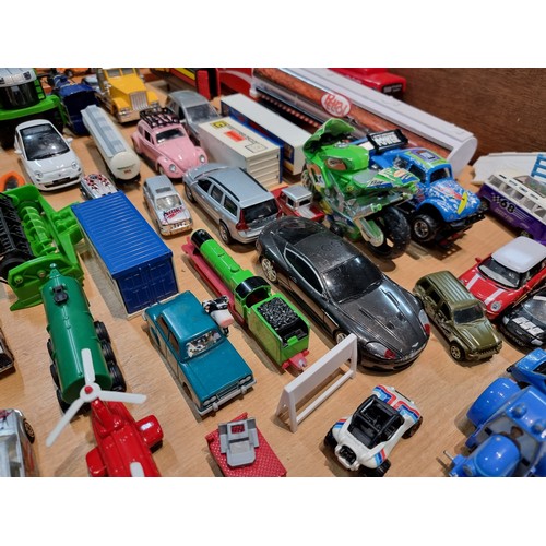 26 - A large quantity of various diecast cars and lorries including a quantity of truck trailers with adv... 