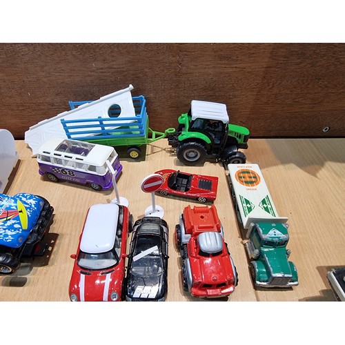 26 - A large quantity of various diecast cars and lorries including a quantity of truck trailers with adv... 