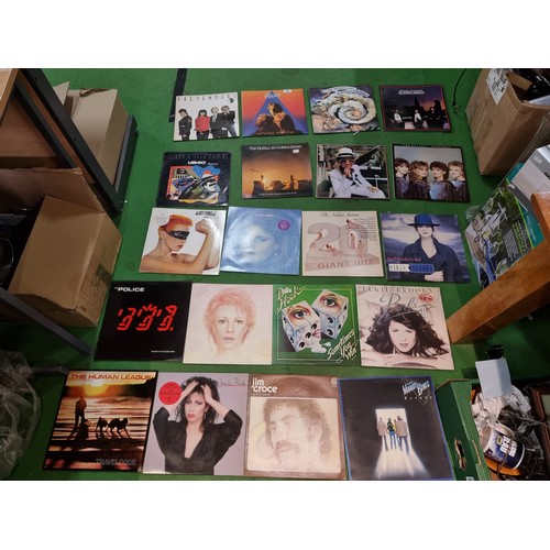 27 - A collection of 20x vintage LP vinyl records to include some good bands and artists including The Po... 