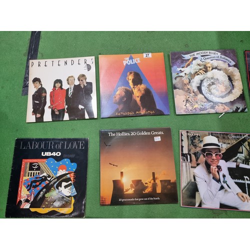 27 - A collection of 20x vintage LP vinyl records to include some good bands and artists including The Po... 