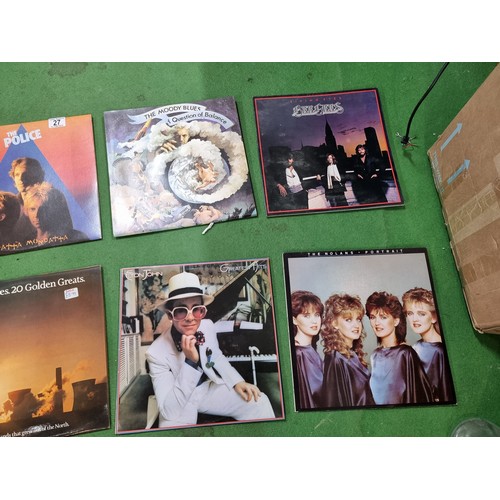 27 - A collection of 20x vintage LP vinyl records to include some good bands and artists including The Po... 