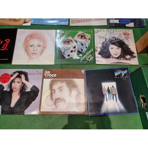 27 - A collection of 20x vintage LP vinyl records to include some good bands and artists including The Po... 