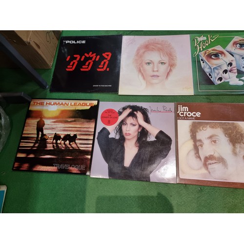 27 - A collection of 20x vintage LP vinyl records to include some good bands and artists including The Po... 