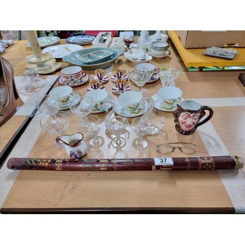 37 - A quantity of collectables to include a set of 4 Chinese cups and saucers with a hand painted design... 