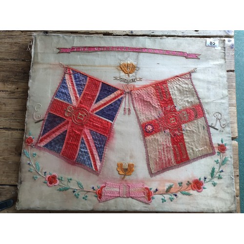 85 - A framed silk of the Cheshire regiment depicting 2 regimental flags and the Cheshire emblem to the t... 