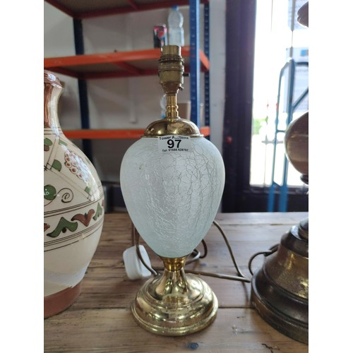 97 - A collection of 3 table lamps including one ceramic lamp converted from a jug, a tall brass handled ... 