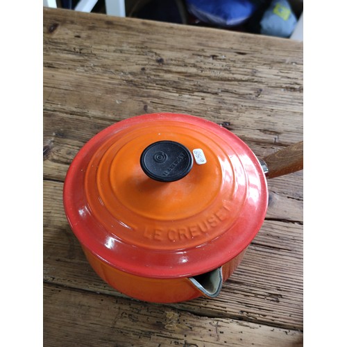 101 - 2 Le Creuset cast iron cooking pots including a casserole dish and one handled saucepan. Height of c... 