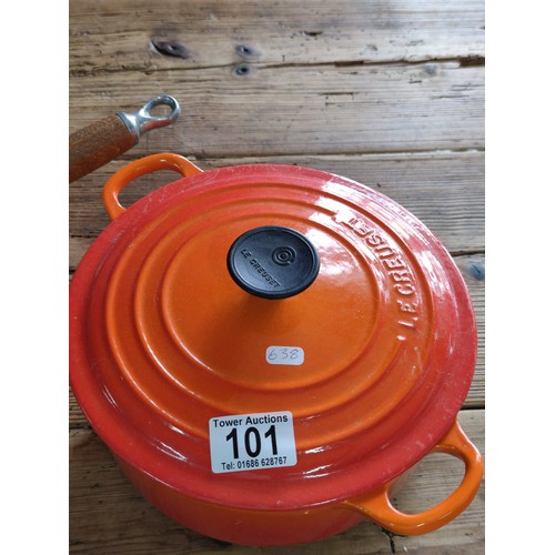 101 - 2 Le Creuset cast iron cooking pots including a casserole dish and one handled saucepan. Height of c... 