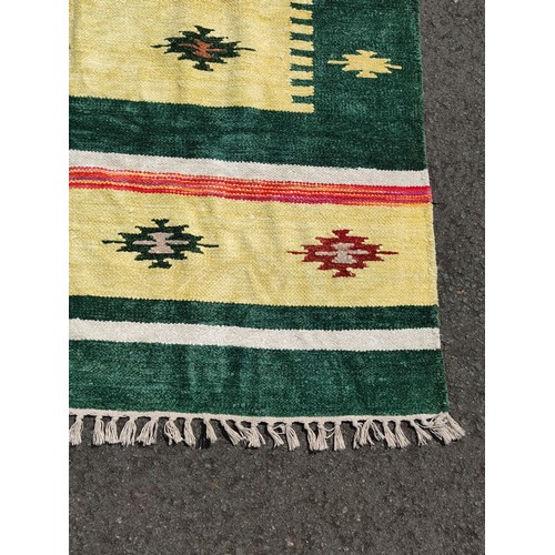 104 - An Aztec design, hand knotted rug, no labels presenting good colours which are not faded and no hole... 