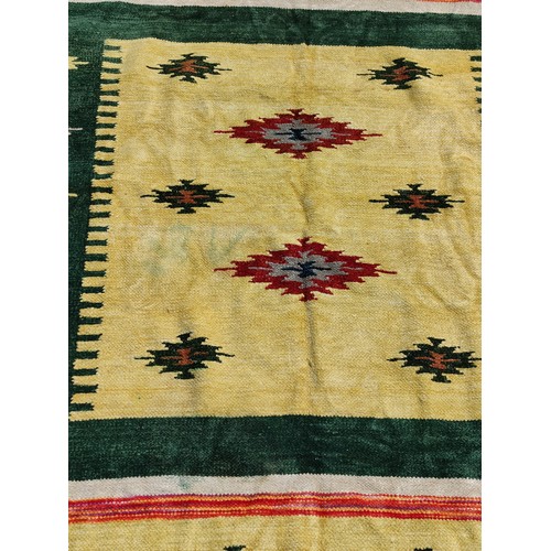 104 - An Aztec design, hand knotted rug, no labels presenting good colours which are not faded and no hole... 