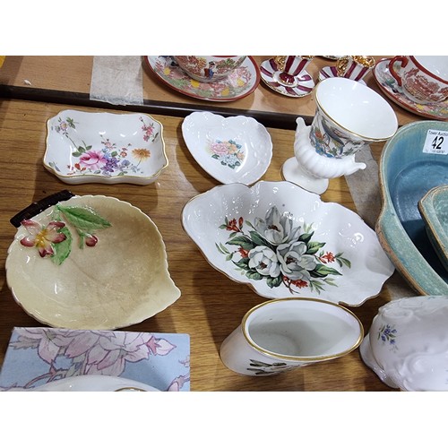 42 - A large collection of collectable china to include many pin dishes, Derby, Worcester, Carlton ware e... 