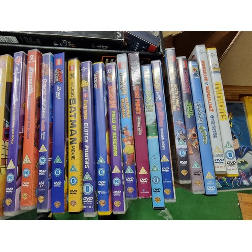 56 - 2x boxes full of various DVD's, mostly animated films and children's films along with a portable DVD... 