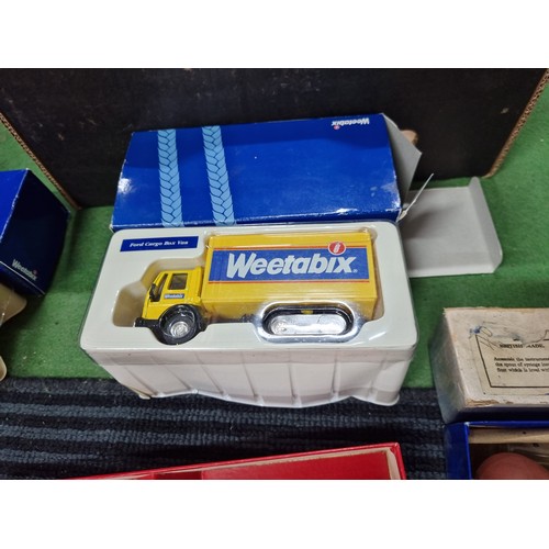 59 - A box of collectables including 2 as new diecast Weetabix lorries, a quantity of new Apple watch str... 