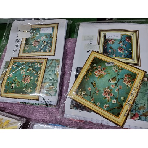 63 - A large quantity of approx 35 new and sealed cross stitch pattern kits in 6 boxes with various desig... 