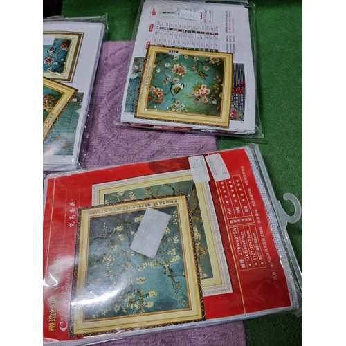 63 - A large quantity of approx 35 new and sealed cross stitch pattern kits in 6 boxes with various desig... 